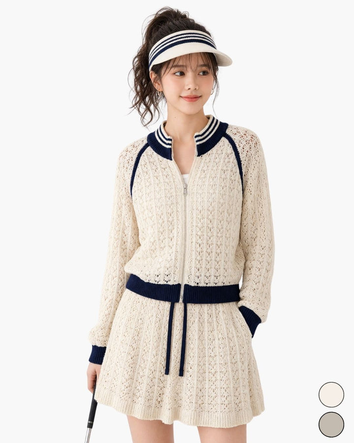 Chamuleのバイカラー透かし編みニットセットアップ。ジップアップトップスとフレアスカートのゴルフウェア