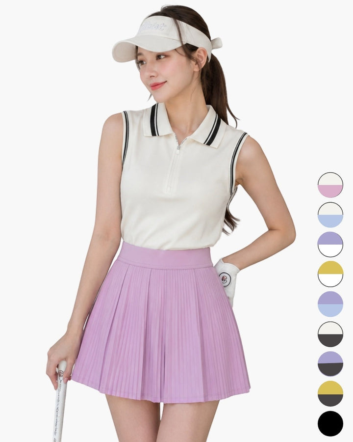 Chamuleのカラフルプリーツセットアップ。襟付きノースリーブトップスとラベンダー色のプリーツスカートを着用した女性ゴルファー。