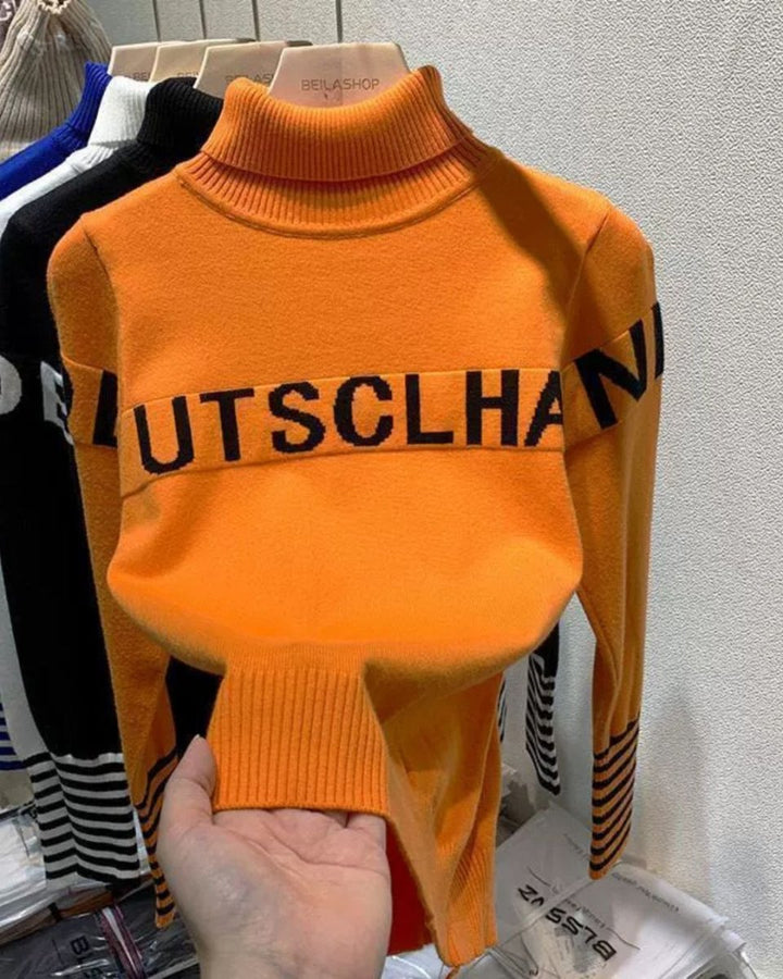 ゴルフトップス レディース タートルネック ロゴ入り ボーダー袖ニット - Chamule